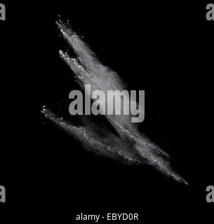 Freeze motion of colored dust explosion isolated on black background Stock Photo