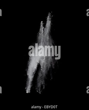Freeze motion of colored dust explosion isolated on black background Stock Photo