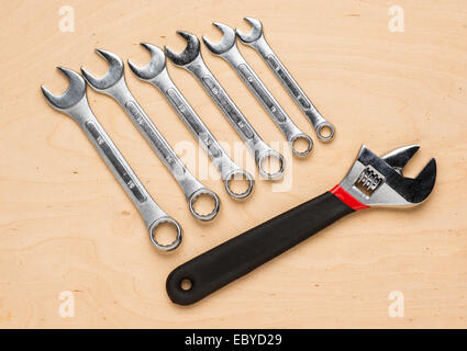 Set of hand tools on a wooden panel Stock Photo