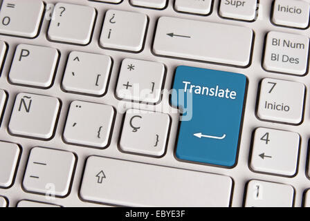Spanish keyboard with language translate concept icon over blue background button.  Image with clipping path for easy change the Stock Photo