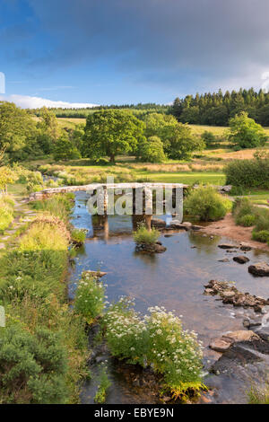 Ancient clapper bridge at Postbridge, Dartmoor National Park, Devon, England. Summer (July) 2014. Stock Photo