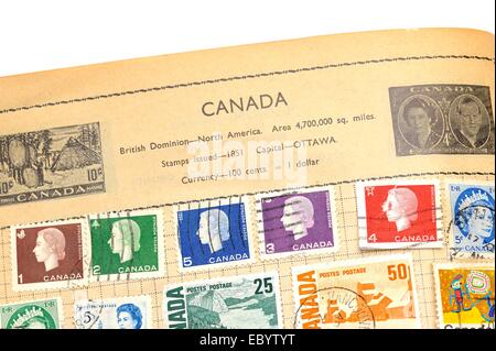 An old fully illustrated stamp album with stamps from Canada Stock Photo