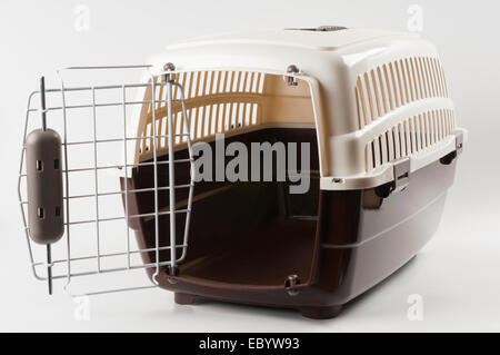 Opened pet travel plastic carrier on white Stock Photo