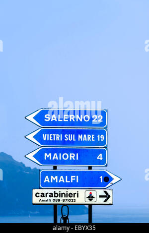 Road signs in Italy with directions in kilometers kilometres for Salerno and Amalfi. Stock Photo