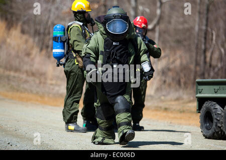 A US Marine Explosive Ordnance Disposal expert with the Chemical Biological Incident Response Force responds to a live chemical agent exercise in a blast suit April 10, 2014 at Fort A.P. Hill, Virginia. Stock Photo