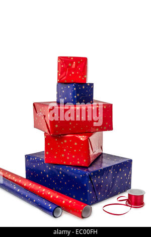 Stack of five presents in different sizes with blue and red wrapping paper and ribbon isolated on white background Stock Photo