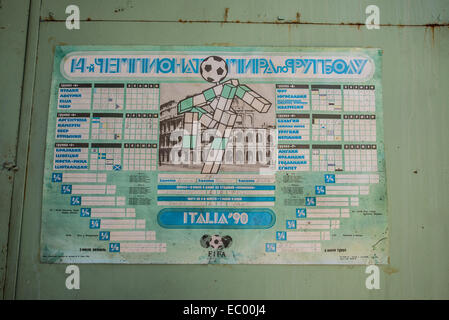 World Cup Italia '90 poster in JUPITER factory in Pripyat abandoned city, Chernobyl Exclusion Zone, Ukraine Stock Photo