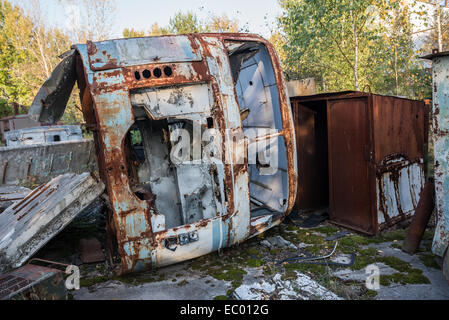 bus wreck in JUPITER factory in Pripyat abandoned city, Chernobyl Exclusion Zone, Ukraine Stock Photo