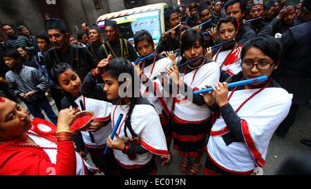 Kathmandu, Nepal. 6th Dec, 2014. People from Newar community play traditional music during a parade markingJyapu Day and Yomari Purnima in Kathmandu, Nepal, Dec. 6, 2014. The Jyapu Day is celebrated every year during the full moon day and Newar community celebrates Yomari Purnima by making Yomari and performing traditional songs and dances. Credit:  Sunil Sharma/Xinhua/Alamy Live News Stock Photo