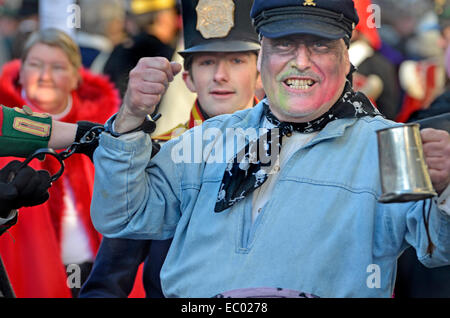 Rochester, Kent, UK. 06th Dec, 2014. Dickensian Christmas Festival - Parade through the town's main street. Drunk being arrested by soldiers Stock Photo