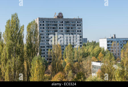 16-story apartment house with emblem of Soviet Ukraine in Pripyat abandoned city, Chernobyl Exclusion Zone, Ukraine Stock Photo