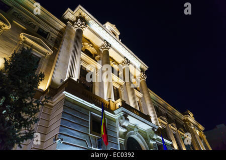 The National Bank of Romania (Banca Naţională a României) building illuminated at night, in Bucharest, Romania. Stock Photo