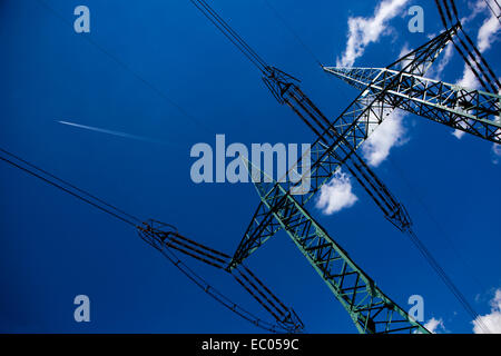 Power lines pylon against blue sky Electric mast Czech Republic Stock Photo