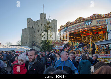 Rochester, Kent, UK. 06th Dec, 2014. The Rochester Dickensian Christmas Festival features a Christmas Market and Fair in the Castle Grounds and other events in the High Street. Many individuals dress up as Dickensian characters to add to the ambience. The festival continues on Sunday 7 December and the following weekend. Credit:  Paul Martin/Alamy Live News Stock Photo