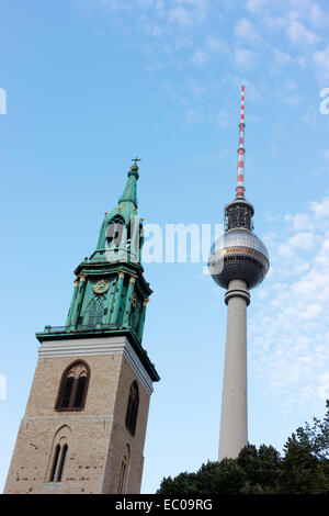 Steeple of St Mary's Church and the television tower in Berlin's centre (Mitte). Stock Photo