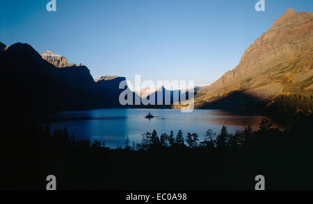 Wild Goose Island on St. Mary Lake at sunrise with mountains in background. Glacier National Park, Montana Stock Photo