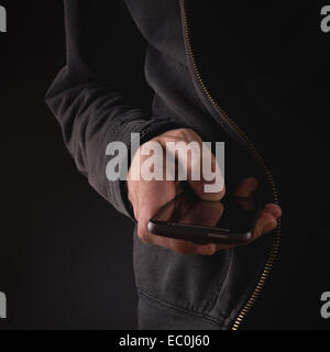 Male Hand with mobile smart phone. New technology concept for e-mails, social networking, wireless internet and information era. Stock Photo