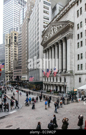 NEW YORK, NY - DECEMBER 01:  New York Stock Exchange building with people on street and other buildings around. in New York City Stock Photo