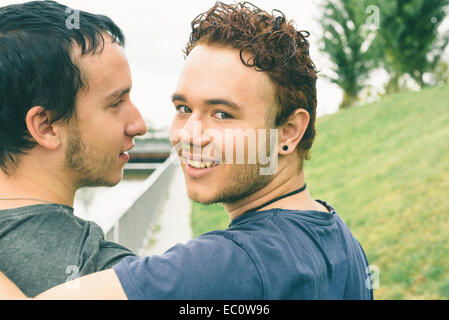 Loving gay couple in outsite Stock Photo