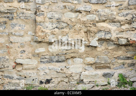 A stone wall background image with texture. Stock Photo