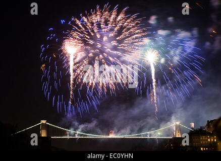 Bristol, UK. 7th Dec, 2014. Isambard Kingdom Brunel's Clifton Suspension Bridge marks the 150th anniversary of its opening with an elaborate fireworks display. Thousands of people lined the streets of Bristol to watch the event. The display was preceded by a one minute silence in memory of Charlotte Bevan and her daughter Zaani, whose bodies were discovered near the bridge earlier this week. Credit:  Adam Gasson/Alamy Live News Stock Photo