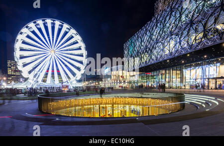 The library of Birmingham in Centenary Square, Birmingham, England, and ferris wheel. Stock Photo
