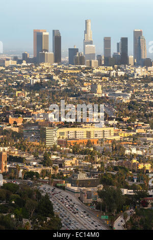 Los Angeles city downtown skyline across Hollywood. Freeway 101 with traffic congestion. View from Mulholland Drive. Stock Photo