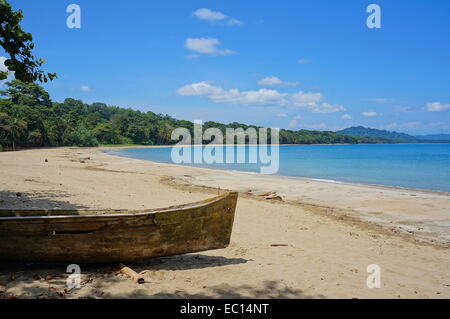 Pristine beach of Punta Uva with an old dugout canoe in foreground, Caribbean coast of Costa Rica, Puerto Viejo de Talamanca Stock Photo