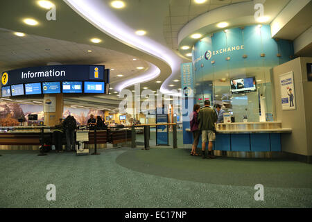Vancouver, BC Canada - September 13, 2014 : People asking some information inside the YVR airport in Vancouver BC Canada. Stock Photo