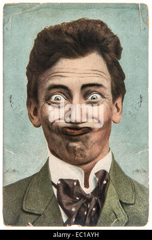 funny handsome man with crazy smile. vintage aged paper picture Stock Photo