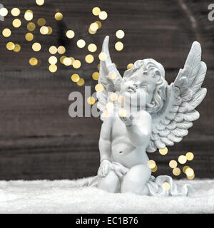 little guardian angel with shiny lights. vintage style christmas decoration Stock Photo