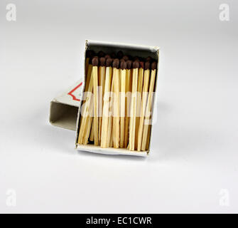 Open matchbox with wooden match sticks. Stock Photo