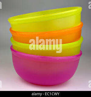Colorful plastic bowls, stacked and ready for use. Stock Photo