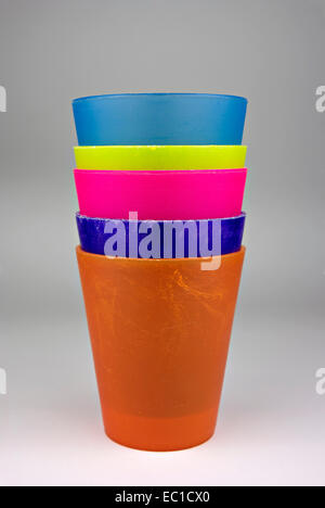 Colorful plastic glasses, stacked and ready for use. Stock Photo