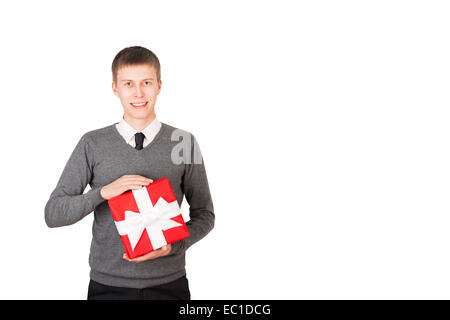 Young man with a christmas present in red packaging, isolated on white Stock Photo