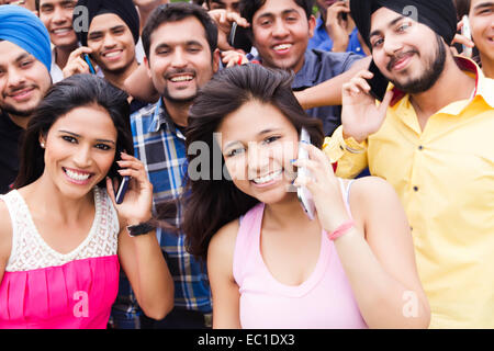 indian group crowds park  talking phone Stock Photo