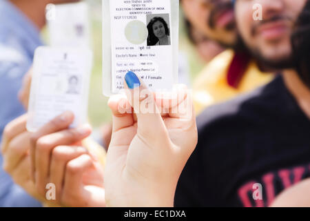 indian group crowds Election line with Voter id card Stock Photo