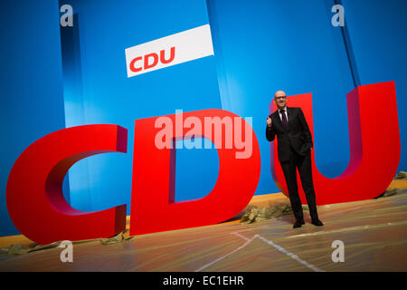 Cologne, Germany. 08th Dec, 2014. Secretary General of the Christian Democratic Union (CDU) Peter Tauber poses in front of the party logo before the federal party convention in Cologne, Germany, 08 December 2014. The party convention takes place on Tuesday and Wednesday. Photo: ROLF VENNENBERND/dpa/Alamy Live News Stock Photo