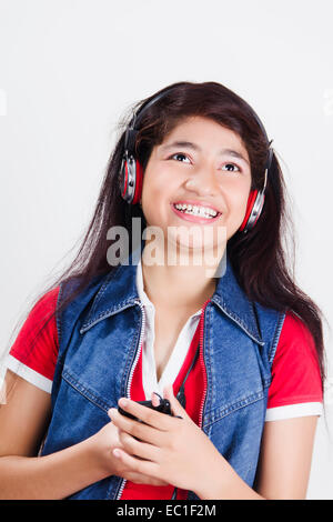 1 indian Beautiful Girl Headphone Hearing Music enjoy Stock Photo