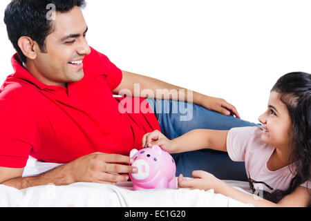 indian father with child saving money Stock Photo