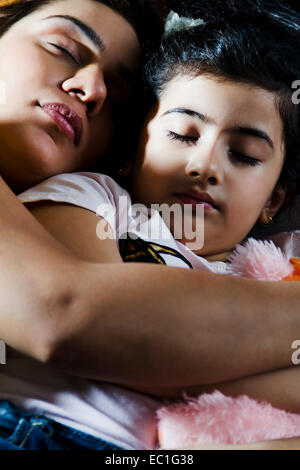 indian mother with  child Sleeping Stock Photo