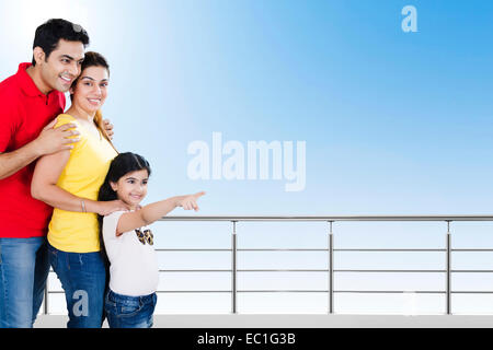 indian Parents with child Balcony side  showing Stock Photo