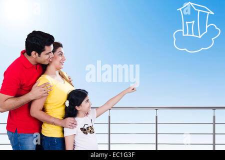 indian Parents with child Balcony side  showing Stock Photo