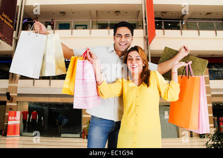 indian Parents with child  mall Shopping Stock Photo
