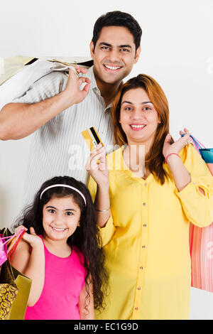 indian Parents with child credit card Shopping Stock Photo