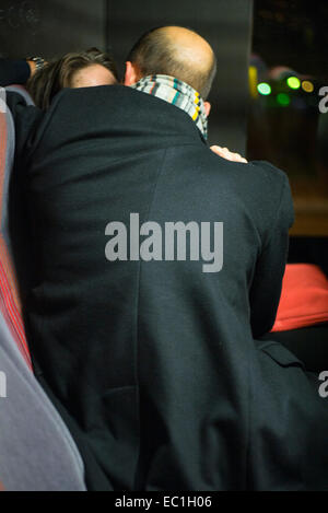couple kissing on bus Stock Photo