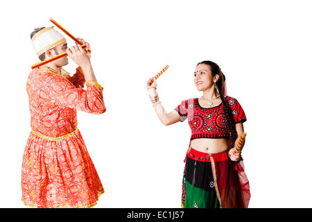 Gujarati couple performing dandiya Stock Photo | Adobe Stock
