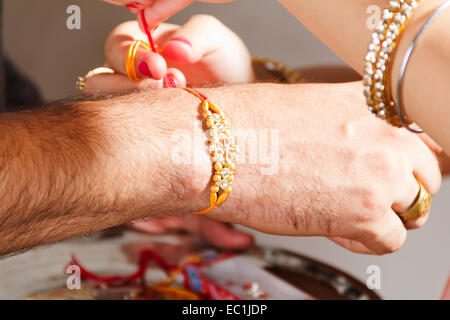 indian Brother and sister Raksha Bandhan Tying Raakhi Stock Photo