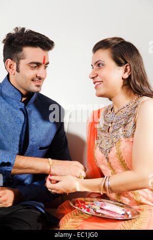 indian Brother and sister Raksha Bandhan Tying Raakhi Stock Photo