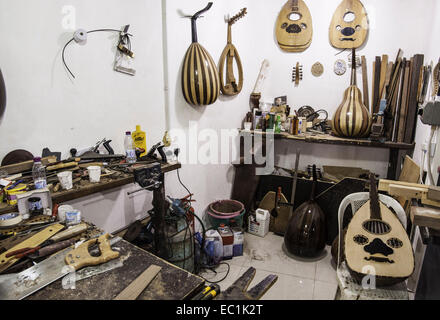 Ouds in construction in Qatari maker's workshop. Showing intricate and ornate woodwork designs of the mandolin-shaped backs. Stock Photo